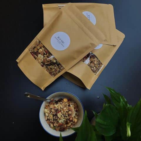 Wild Buns Bakery Granola bags on a table with bags