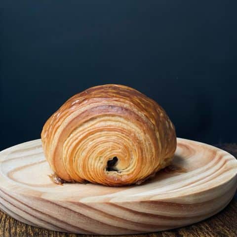 Croissant on the wooden plate