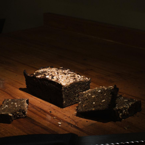 Bakery Fresh Rye bread on the table, some slices